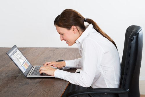 Young Happy Businesswoman Working On Laptop In Office